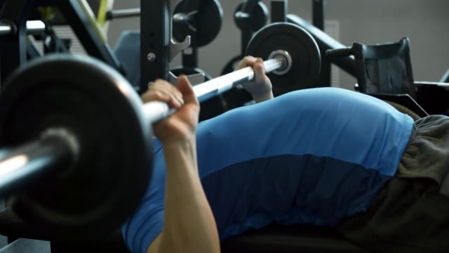 Man-Doing-Chest-Press-on-Bench