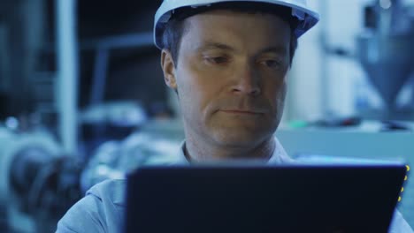 Engineer-in-Using-Tablet-in-Factory