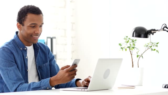 Using-Smartphone,-Browsing-Afro-American-Man