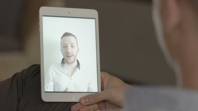 Man-Communicating-With-Digital-Tablet.-Friends-Having-Fun-Talking-Via-Video-Chat.
