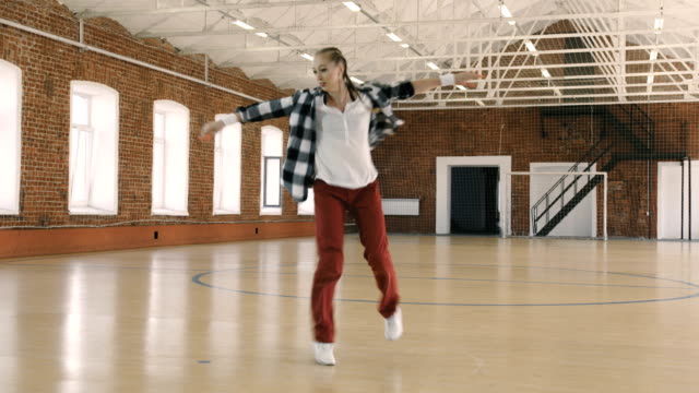 B-girl-dancing-breakdance-in-sport-gym