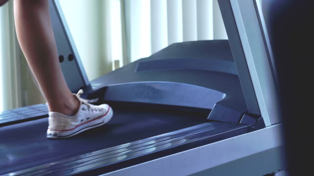 Young-Woman-Exercising-on-the-Treadmill-Machine