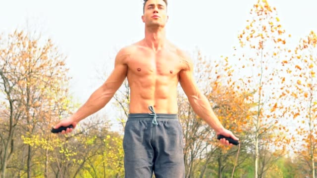 Shirtless-man-practicing-on-a-jumping-rope