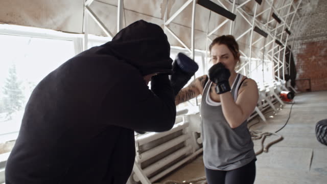 Female-Boxer-Sparring-with-Male-Coach