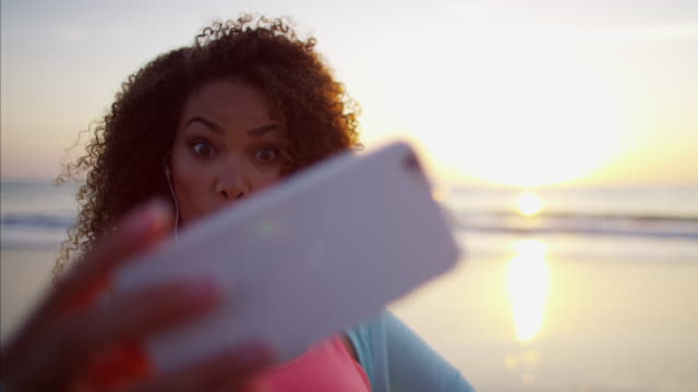 African-American-female-taking-selfie-with-smart-phone