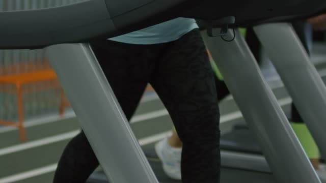 Woman-Having-Fun-on-Treadmill-in-Gym