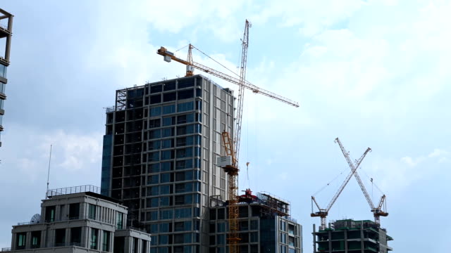Timelapse-of-working-tower-cranes-at-construction-site