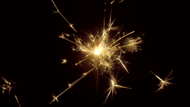 Firework-sparkler-burning-on-black-background