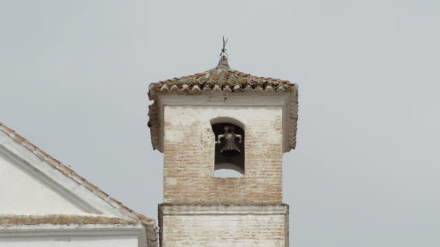 Antique-church-bell-tower-built-on-an-Arab-minaret-in-Daimalos,-Spain
