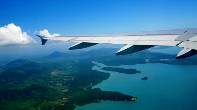 Travel-video-View-from-the-airplane-window-through-the-wings-and-engine-While-flying-During-the-take-off-.