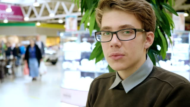 Portrait-of-a-young-man-in-a-mall.
