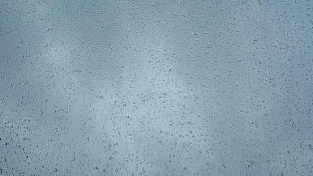 Heavy-rain-against-a-window,-tripod-footage.