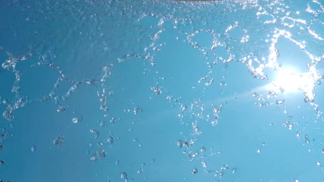 Water-coming-down-in-the-sun-(slow-motion)