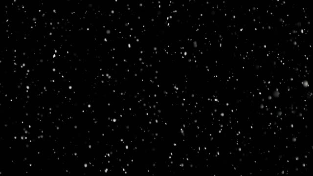 White-Snow-Falling-on-Isolated-Black-Background