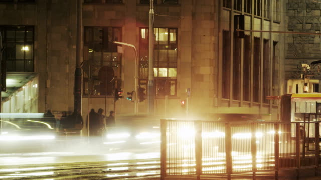 Cars,-Trams-and-Buses-on-a-Busy-Junction.-Time-Lapse