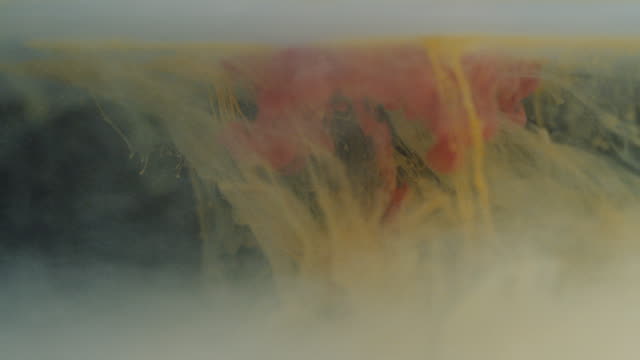Yellow-and-Red-Paint-Colors-Dissolving-Under-Water