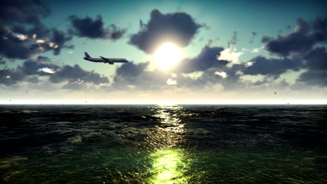 Passenger-plane-flies-over-the-ocean-at-sunrise.-Beautiful-summer-looped-background.