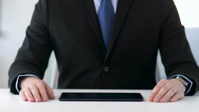 close-up-of-businessman-with-tablet-pc-at-office