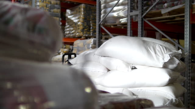 Raw-goods-in-industrial-warehouse---sugar-inside-a-large-storage