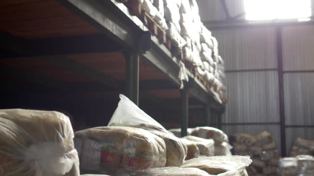 Shelves-of-cardboard-boxes-inside-a-storage-food-warehouse