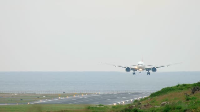 Widebody-aircraft-approaching-over-ocean