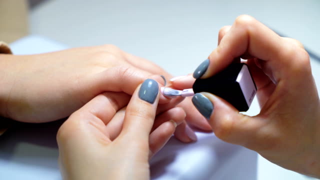Professional-manicure-procedure-in-beauty-salon