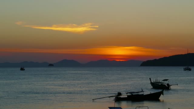 Long-tail-boats-at-sunset,-Thailand,-timelapse