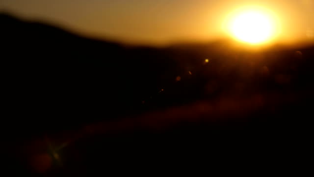 background-of-dusk-in-mountains-with-rays-and-lens-flare