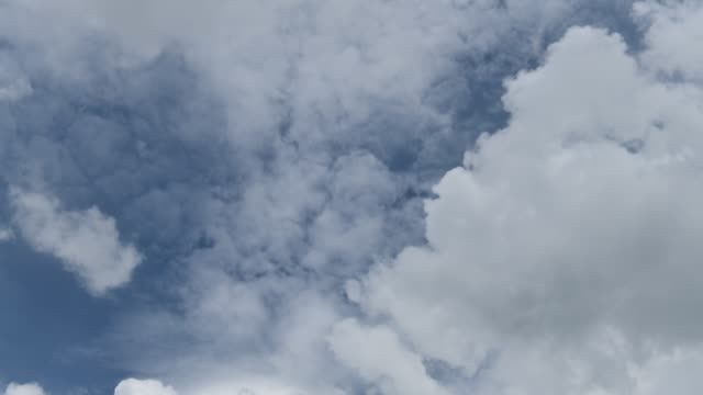 Time-lapse-clip-of-white-clouds-over-blue-sky