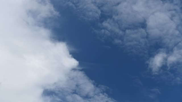 Time-lapse-clip-of-white-clouds-over-blue-sky