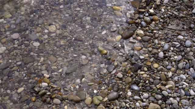 bank-wave-water-beach-stones-sand