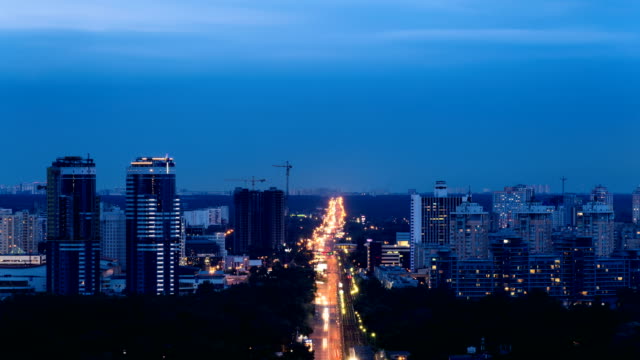 Traffic-time-lapse-of-Kyiv-city,-city-skyline-at-sunset.