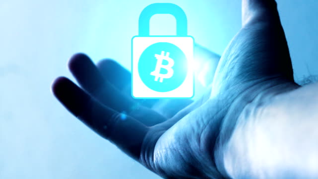 a-bitcoin-lock-that-orbits-on-the-palm-of-a-man's-hand