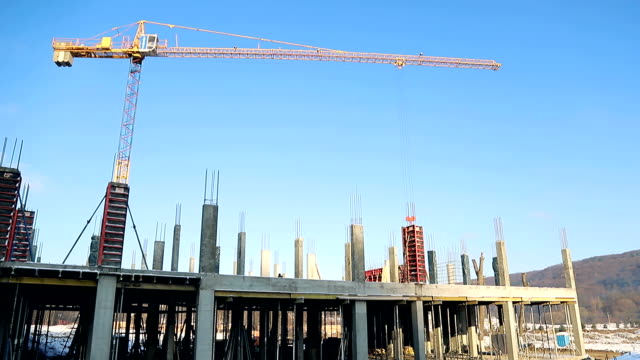 Construction-site-in-good-weather.-construction-crane-on-the-background-of-a-blue-sky