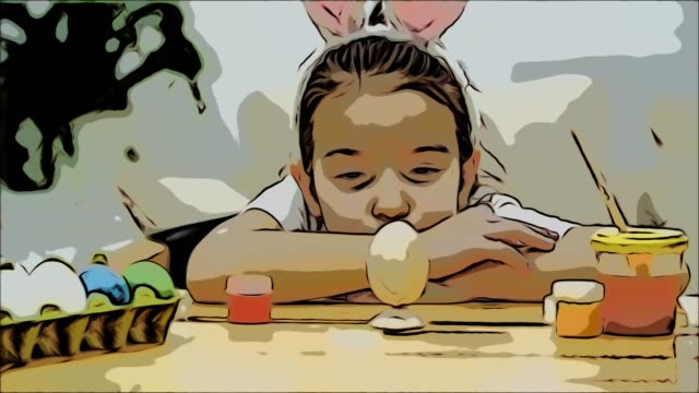 Tired-cute-girl-is-lying-down-the-table-and-watching-at-her-creation.-Suddenly,-girl-turns-over-an-Easter-egg-and-we-see-how-she-has-colourized-it.