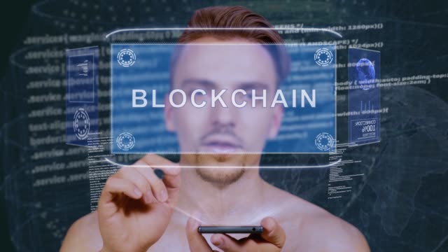 Guy-interactúa-con-el-holograma-de-HUD-blockchain
