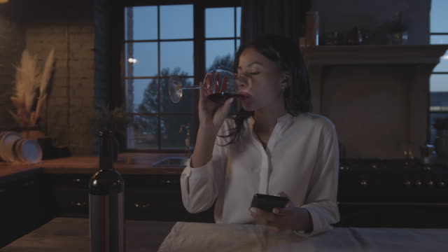 Businesswoman-Drinking-Wine-in-the-Evening