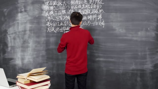 Young-Scientist-Writing-on-Blackboard