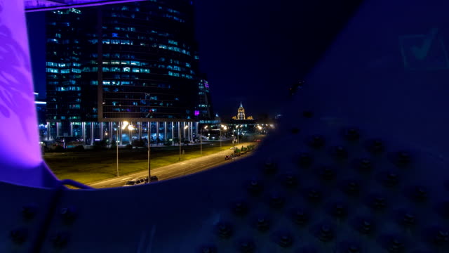 Moscow-river-near-the-skyscrapers-of-Moskva-City-district-in-the-night-timelapse-view-under-the-bridge