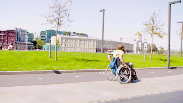 Young-disable-man-in-a-wheelchair-in-the-city