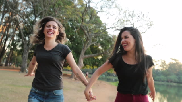 LGBT-couple-running-holding-hands