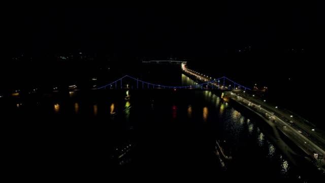 Aerial-view-from-Drone:-Top-view-of-the-night-promenade-with-bridges-and-cars.
