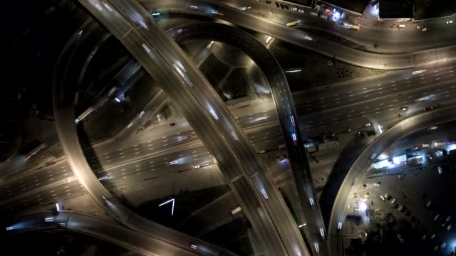 Traffic-on-freeway-interchange.-Aerial-night-view-timelapse-city-traffic.