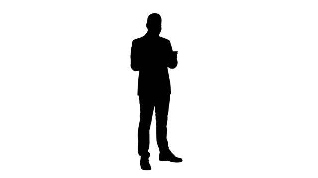 Silhouette-Businessman-Reading-or-Working-on-a-digital-tablet
