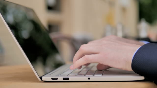 Typing-on-Laptop-Keyboard,-Outdoor