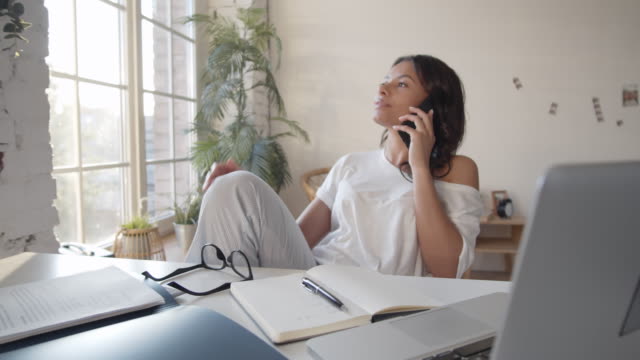Woman-Having-Call-during-Work-at-Home