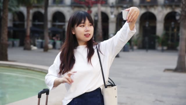 chinese-female-tourist-making-selfie
