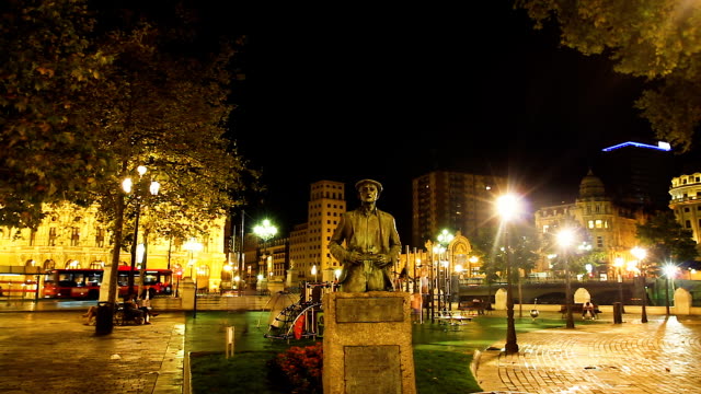 Statue-of-famous-writer-Balendin-Enbeita-Goiria-in-river-park-Bilbao,-Spain