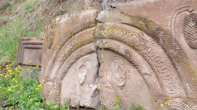 Ancient-bas-relief-caucasus-old-carved-stones-in-rock-cut-cave-monastery-Vardzia,-excavated-from-the-slopes-of-the-Erusheti-Mountain,-Samtskhe-Javakheti,-Georgia