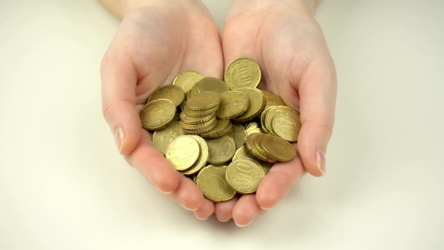 Euro-Münzen-in-Menschenhand.-Wirtschaftskonzept.